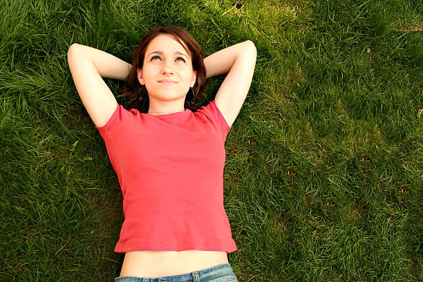 istock Woman Relaxing in Grass - Copy Space 185006327