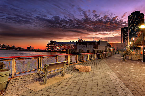 Sunset over promenade in Manhattan, New York City..