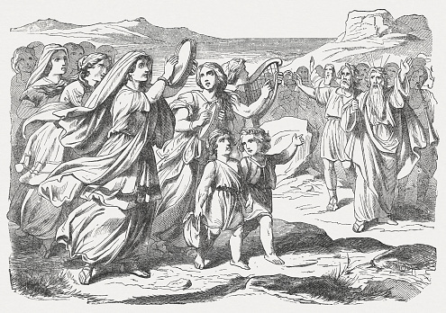 Miriam the prophetess, the sister of Aaron, took a hand-drum in her hand, and all the women went out after her with hand-drums and with dances. Miriam sang in response to them, “Sing to the Lord, for he has triumphed gloriously; the horse and its rider he has thrown into the sea.” (Exodus, Chapter 15, 20-21). Woodcut engraving after a drawing by Julius Schnorr von Carolsfeld (German painter, 1794 - 1872), published in 1877.