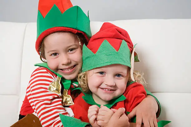Two cute girls dressed as elves.