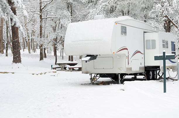 Recreational vehicle in winter campsite stock photo