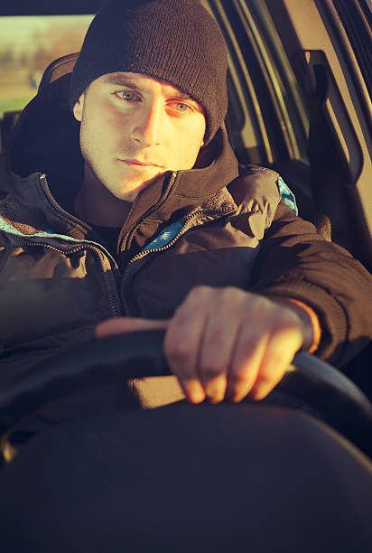 istock Young man driving his car 185007246