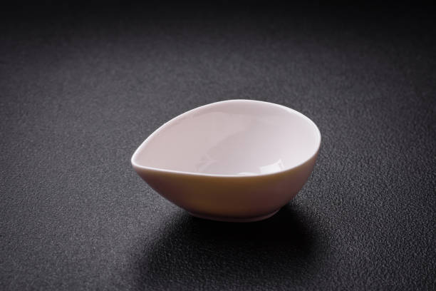 istock Beautiful empty white ceramic gravy boat on a textured concrete background 1850074038