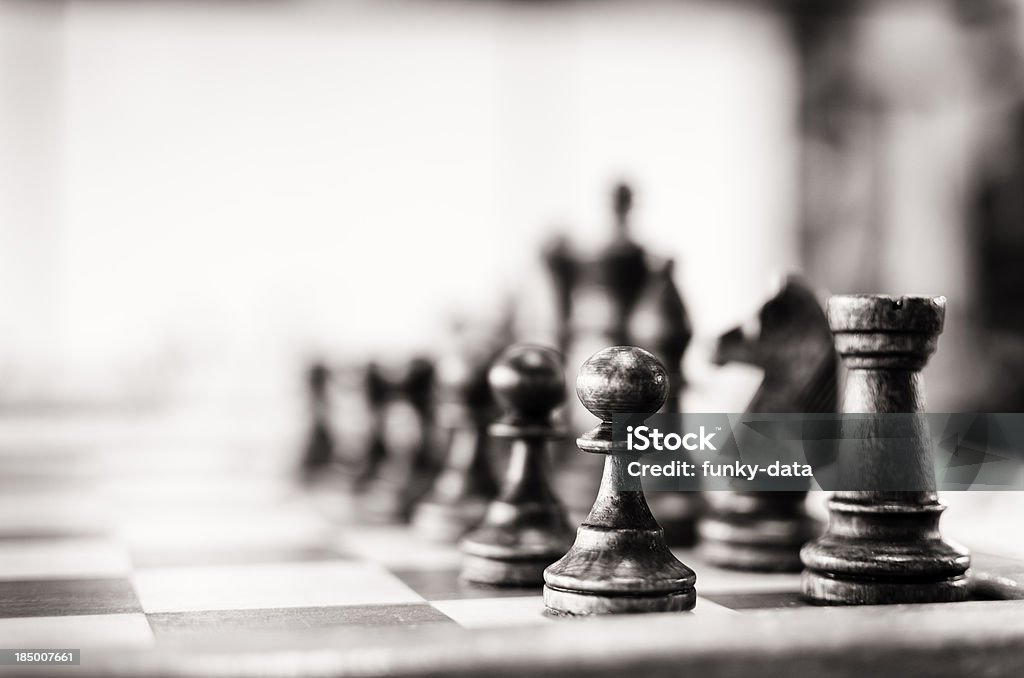 Vintage chess board Chess pieces pawn and castle (rook) visible. Selective focus. Vintage outlook given. Some noise present.More Chess Chess Stock Photo