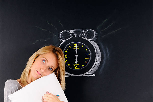 istock Young Woman Wake up and Alarm Clock 185007949