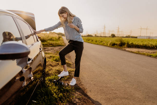 istock Woman changing tire 1850079731