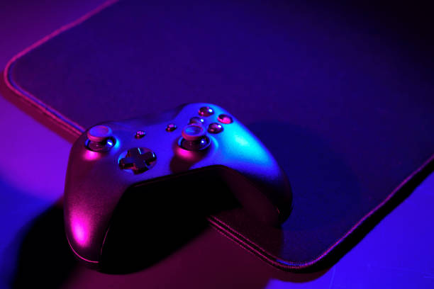 istock Gaming joystick on black background in neon light 1850080286