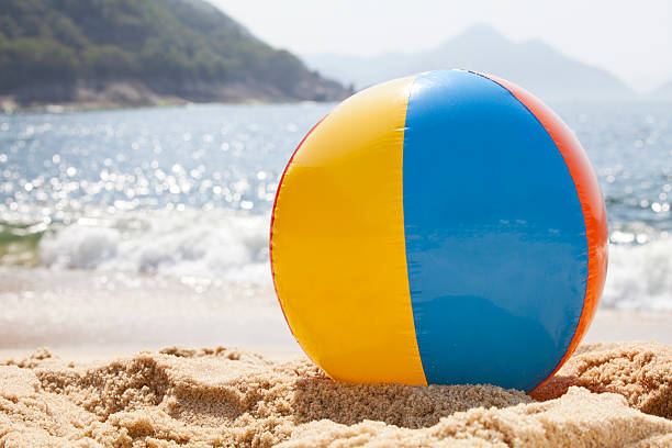Beach ball by the ocean on the sand in Rio de Janeiro. You might also be interested in these: