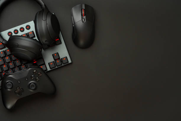 istock Gaming concept on black background with computer keyboard and joystick 1850080819