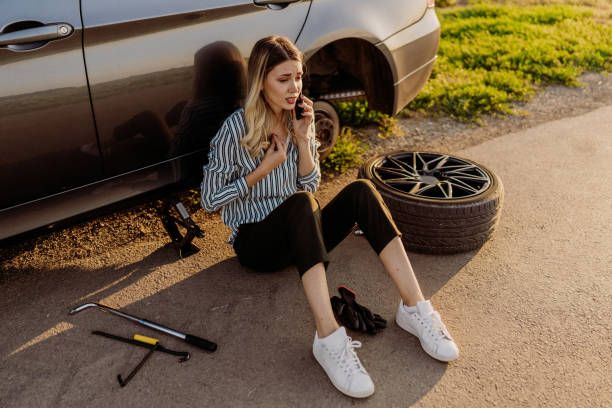 Woman changing tire