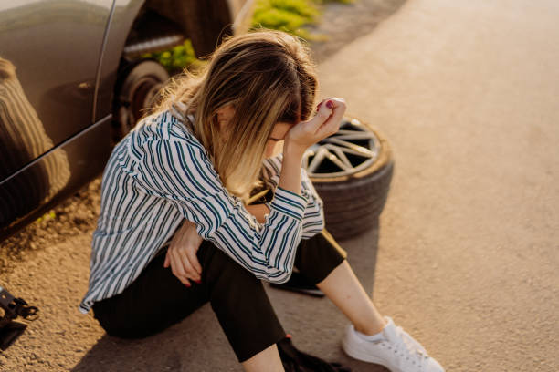istock Woman changing tire 1850081331