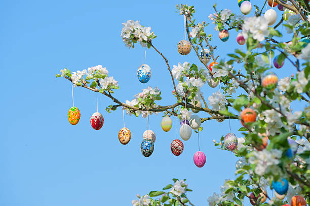 eastereggs hanging on apple tree. A lot of colorful and handmade eggs. More of this series: