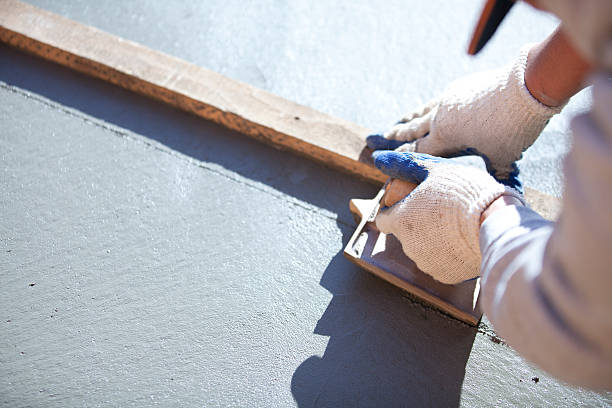 istock Patio: installing joints in freshly poured concrete patio 185008272