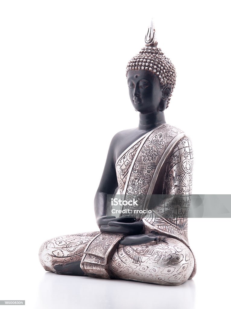 A beautiful Buddha statue on a white background Statue of Buddha in lotus position, left view rotate 45º counterclockwise, isolated on white background, with reflection. Buddha Stock Photo