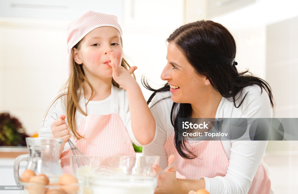 Delicious cream Mother and daugther making creme 30-39 Years Stock Photo