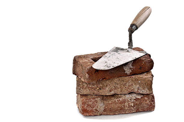 istock Dirty Red Brick and Trowel 185008776