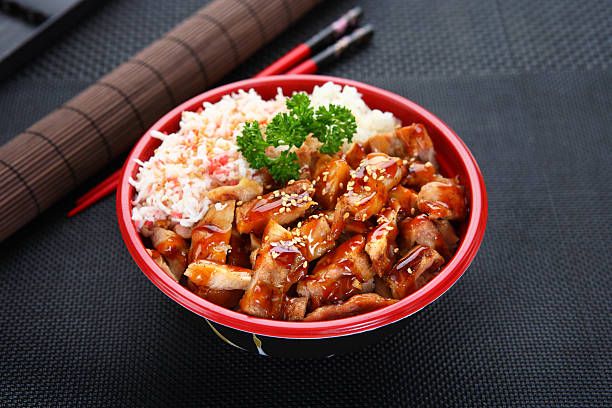 Red bowl of delicious chicken teriyaki Chicken Teriyaki Bowl with imitation Crab meat teriyaki stock pictures, royalty-free photos & images