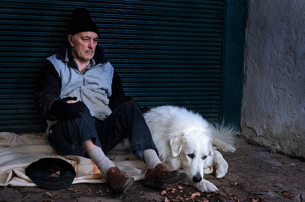 istock Homeless man with his dog 185009309
