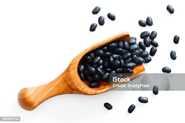 Black Beans Spilling From A Wooden Scoop Stock Photo - Download Image Now - Black Bean, Bean, White Background