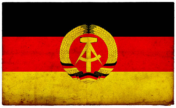 Grunge Former East German Flag on rough edged old postcard Grunge Former GDR  Flag on rough edged old postcard.For more of this series please see this lightbox east germany stock pictures, royalty-free photos & images