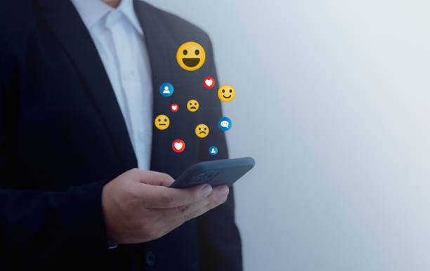 istock Man uses smartphone to rate satisfaction with online service, satisfaction concept Taking an online assessment 1850097773