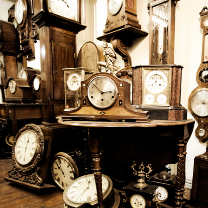 A shop filled with many clocks