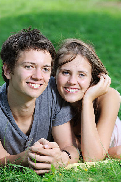 istock Young Boy and Girl smiling on Grass 185010168