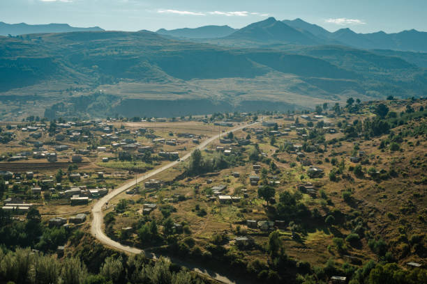 A road winding through the Lesotho town of Quthing on a sunny morning