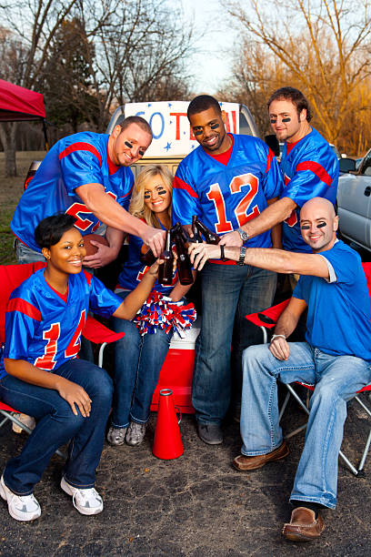 istock Happy football fans tailgating 185010315