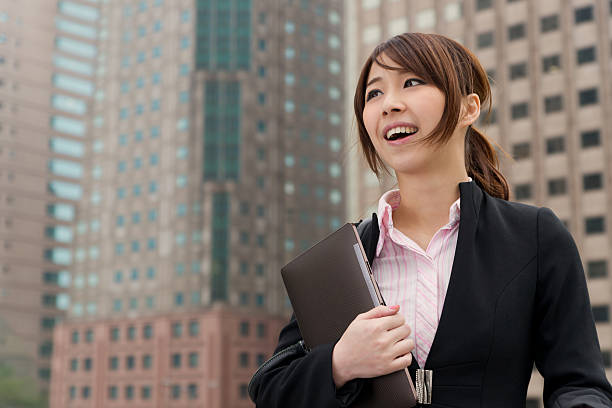 istock Young attractive businesswoman holding pad 185010481
