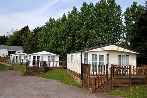 Residential mobile home on a quality caravan park estate Residential mobile home park. Generally this type of caravan park estate is for home owners over the age of fifty years. manufactured housing stock pictures, royalty-free photos & images