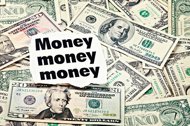 istock Money headlines backed up by many US dollars 185010963