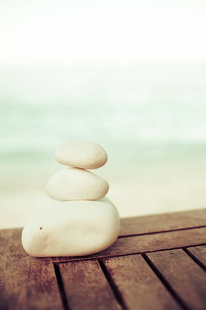 istock Massage stone on a wooden table 185011115