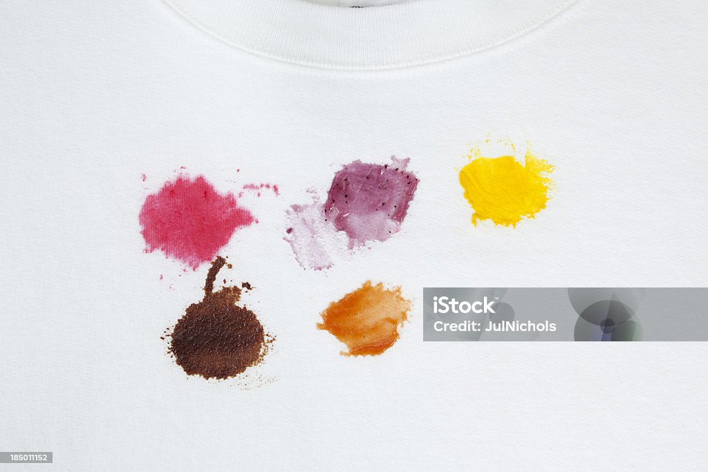 Various Food Stains on a White Cotton Sweatshirt "Various difficult to remove food stains on a white cotton sweatshirt.The food stains are from cranberry sauce, blueberry pie, mustard, chocolate syrup, and ketchup." Stained Stock Photo