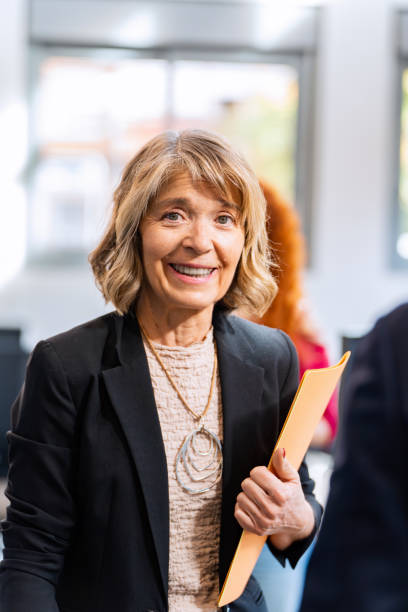 istock Mature businesswoman smiling while posing in the office. 1850111565