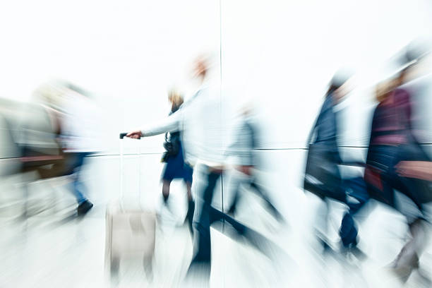 istock Crowd of People Rushing, White Background, High Key, Blurred Motion 185011171