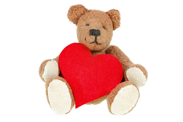 istock teddy bear with heart isolated on white 185011936