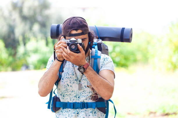 istock Hiker man taking landscape photos in a forest 1850121308
