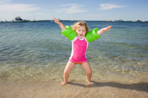 Little girl excited at beach.