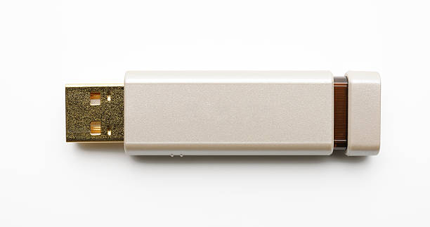 istock Isolated shot of gold USB Flash Drive on white background 185012237
