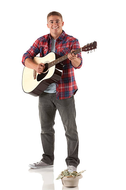 istock Portrait of man playing a guitar 185012610