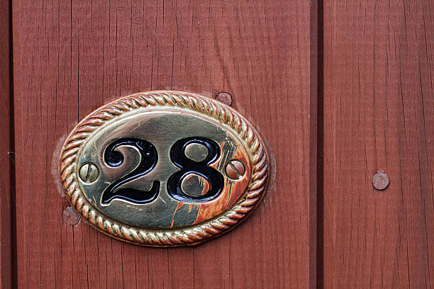 istock Twenty-eight metal number 28 on wooden gate 185012633