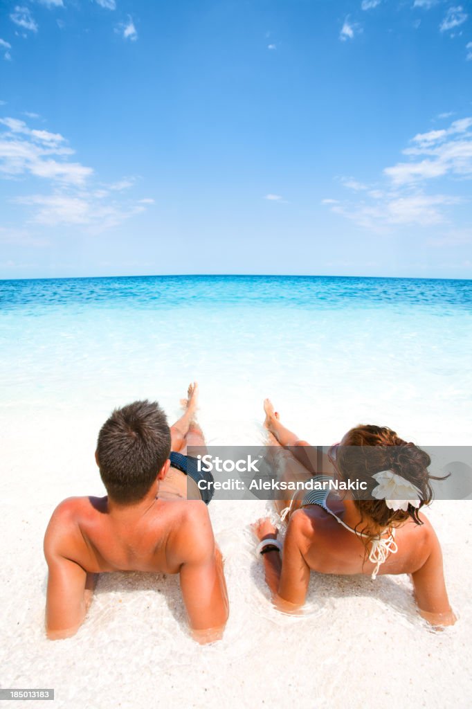 Couple relaxing in a water Beach Stock Photo
