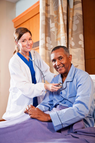 istock Doctor using stethoscope on senior patient 185013288