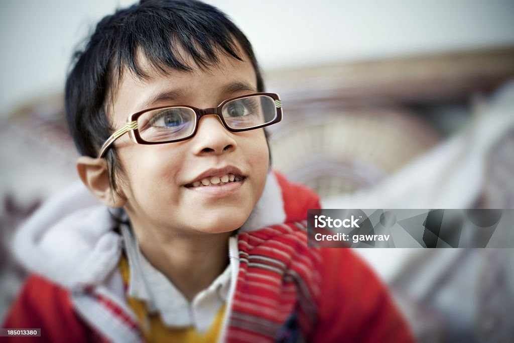 Bespectacled Indian, little boy watching TV "Bespectacled Indian, little boy watching TV." Boys Stock Photo