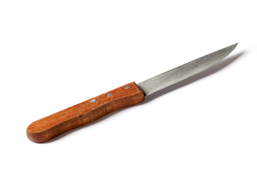 A picture of a steak knife on a white background.