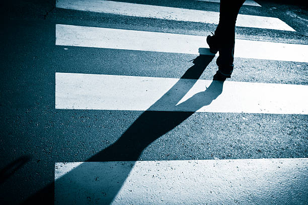 istock Solitary Shadow Crossing the Street 185013572