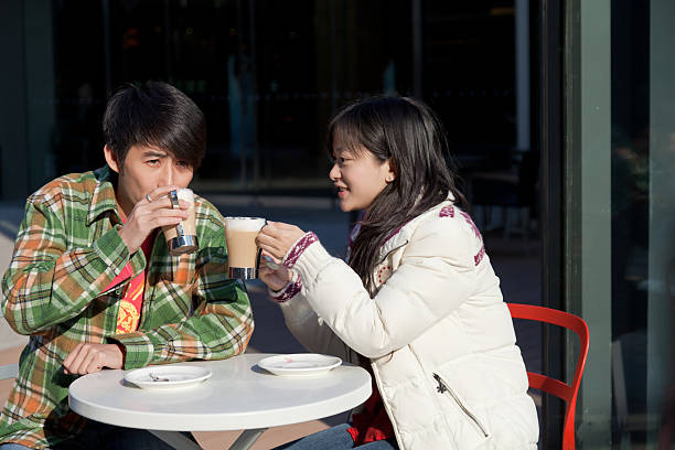 istock young couple drinking coffee in the dating 185013577