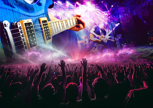 Live music and concert background. Guitarist and drummer and singer.Night entertainment and festival events.