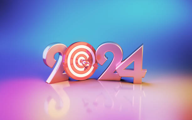 istock New Year 2024 and Target Board Sitting on Soft Blue Pink Orange Background 1850141591